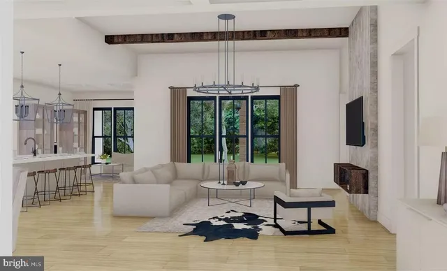 a living room with furniture a chandelier and a flat screen tv