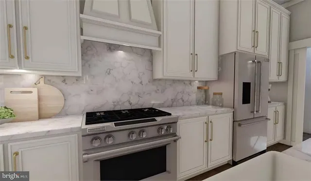 a kitchen with cabinets appliances and a wooden floor