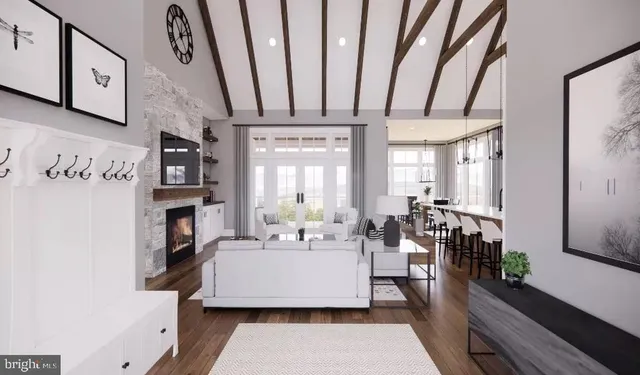 a living room with fireplace furniture and a table