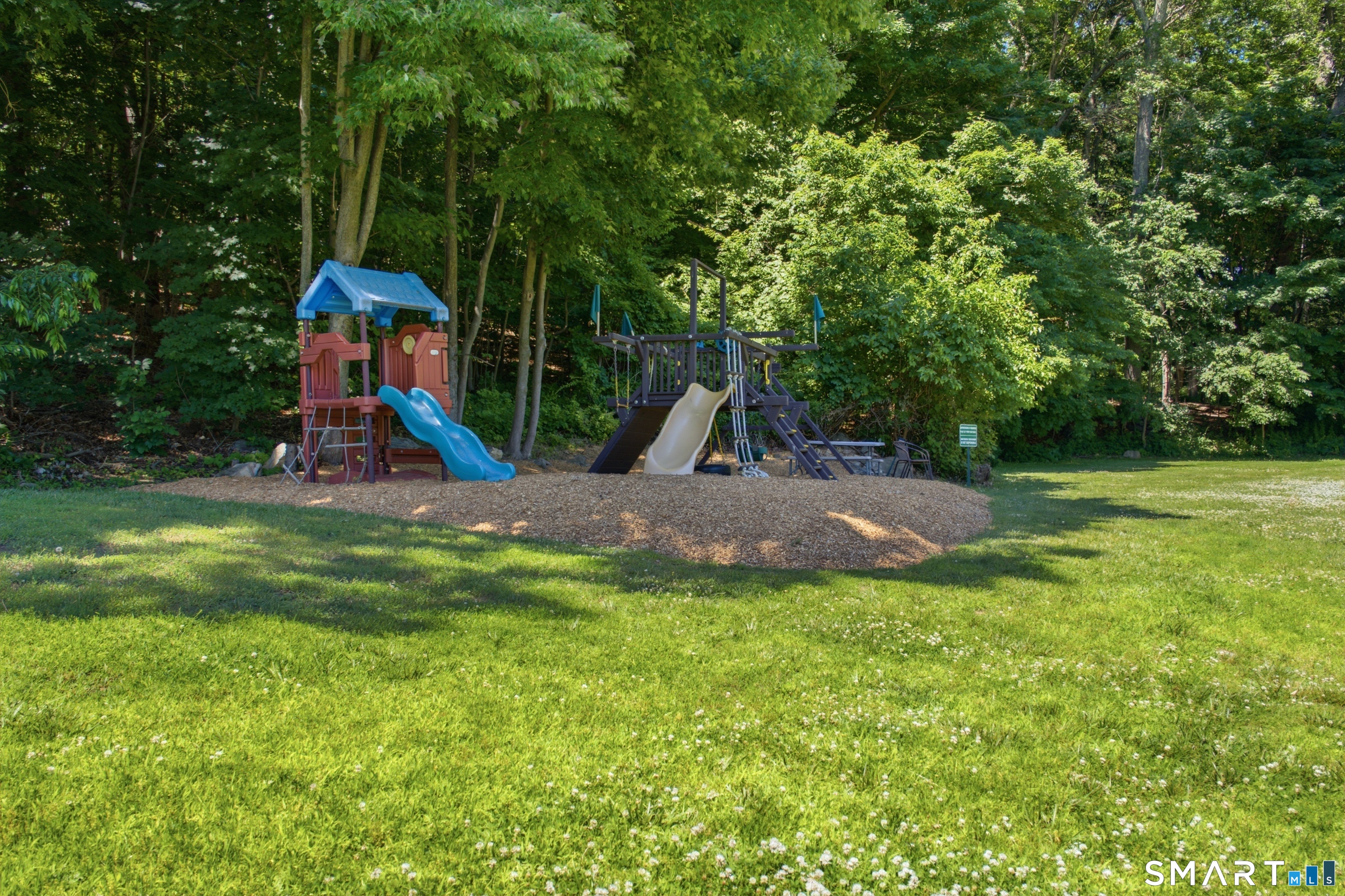 25 Padanaram Road, Unit 66 Danbury, CT 06811 - Photo 17 of 19 Community Playground and Picnic Table
