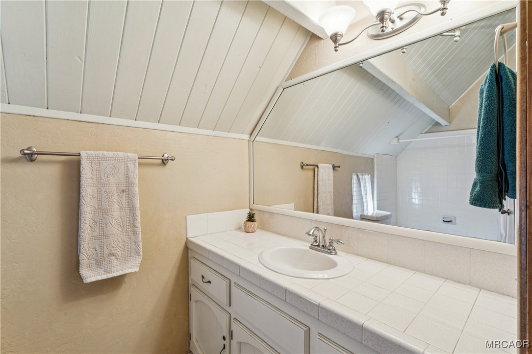 296 Massive Road Lake Arrowhead, CA 92352 - Photo 20 of 43 a bathroom with a sink and a mirror