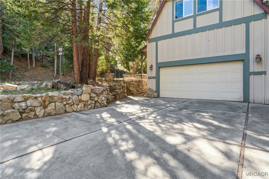 296 Massive Road Lake Arrowhead, CA 92352 - Photo 29 of 43 a view of a house with a yard