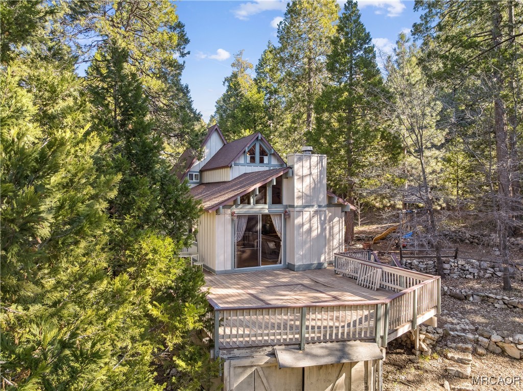 296 Massive Road Lake Arrowhead, CA 92352 - Photo 33 of 43 a front view of house with yard outdoor seating and barbeque oven