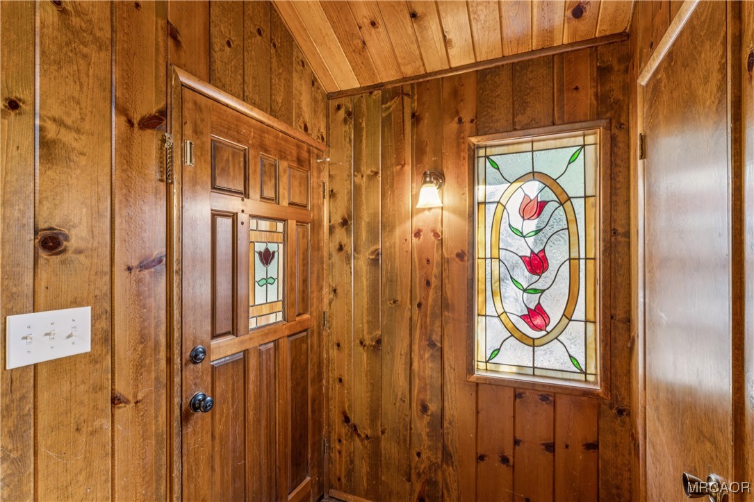 296 Massive Road Lake Arrowhead, CA 92352 - Photo 6 of 43 a bathroom with a shower curtain and a window