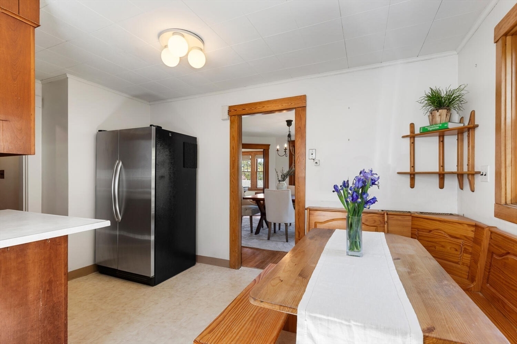 28 Spring Street Lexington, MA 02421 - Photo 13 of 39 a living room with stainless steel appliances furniture a chandelier and a view of kitchen