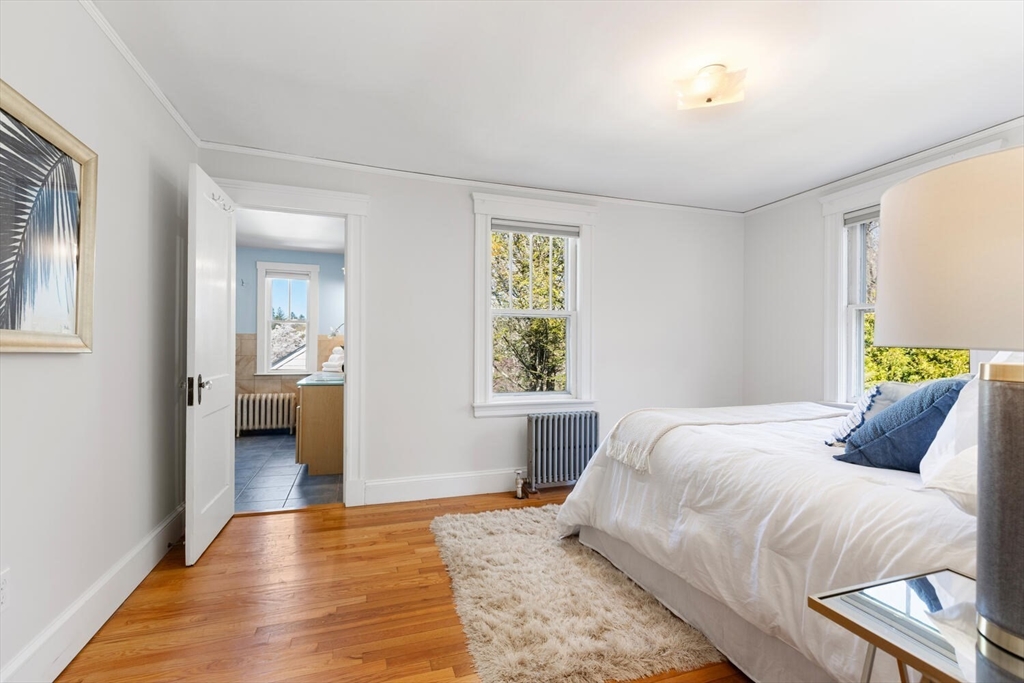 28 Spring Street Lexington, MA 02421 - Photo 17 of 39 a bedroom with a bed and a window