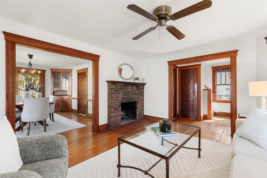 28 Spring Street Lexington, MA 02421 - Photo 8 of 39 a living room with furniture and a fireplace