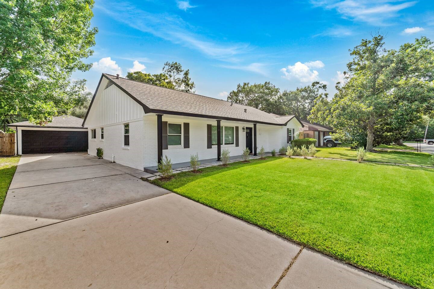 a view of a house with a backyard
