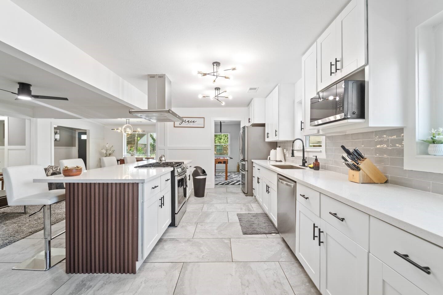 1206 Timber Lane Friendswood, TX 77546 - Photo 7 of 19 a kitchen with cabinets and window