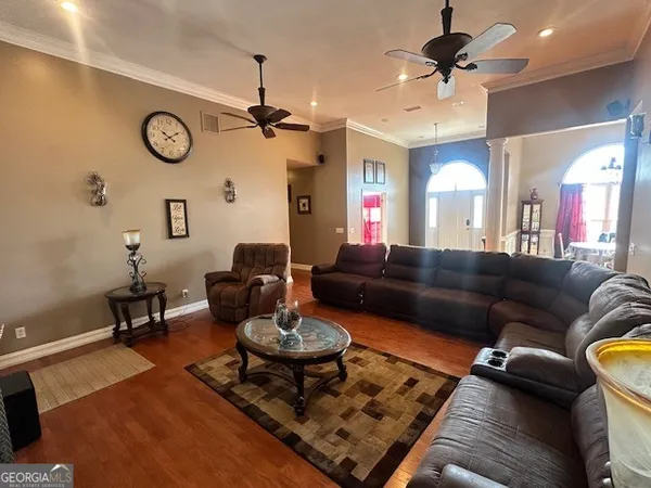 a living room with furniture and a rug