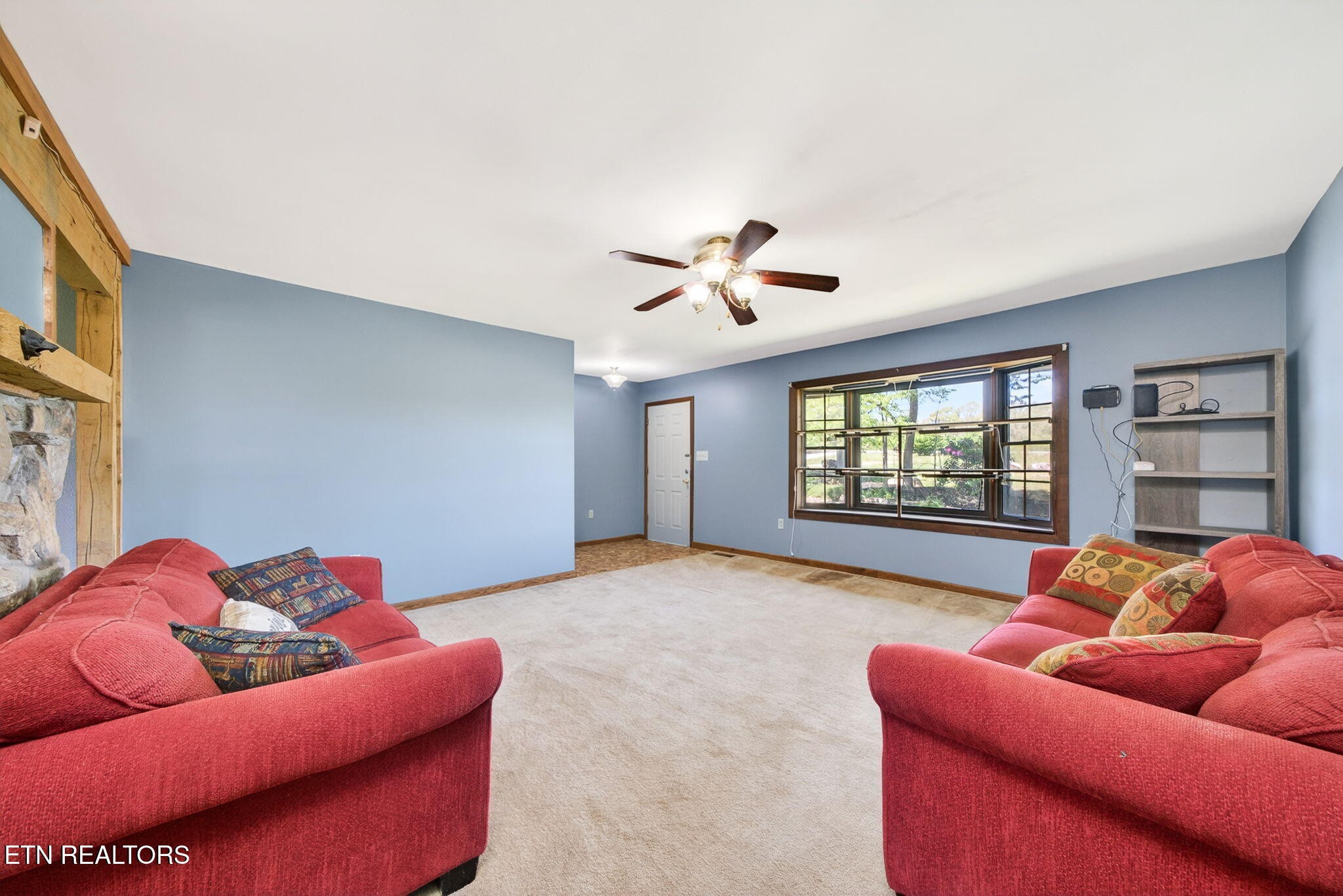 935 Brewer Road Crossville, TN 38572 - Photo 16 of 51 a living room with furniture and a large window