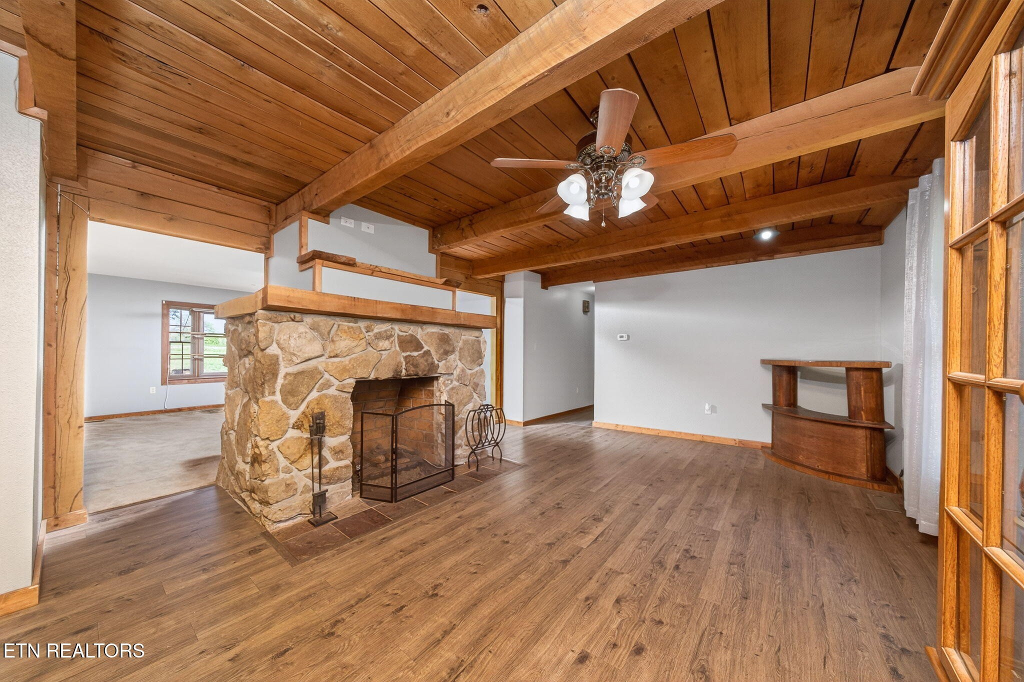 935 Brewer Road Crossville, TN 38572 - Photo 18 of 51 a view of empty room with wooden floor and fireplace