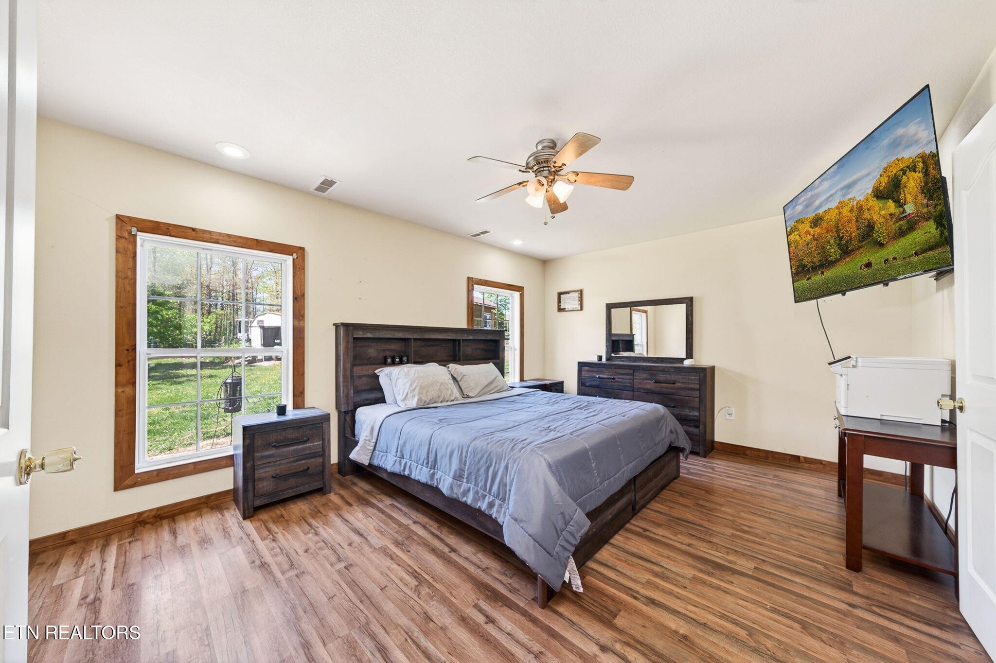 935 Brewer Road Crossville, TN 38572 - Photo 21 of 51 a bedroom with a bed and a flat screen tv