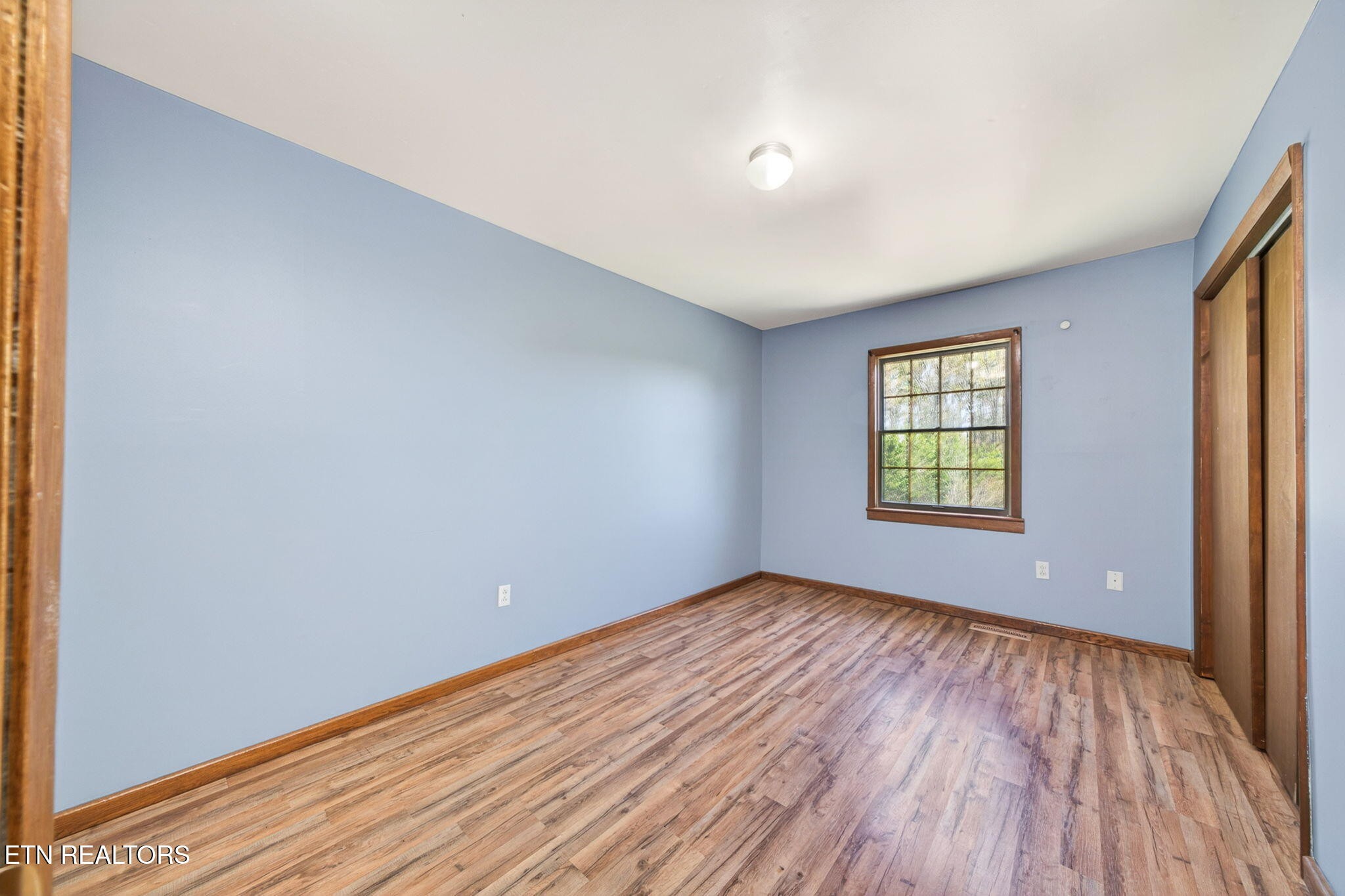 935 Brewer Road Crossville, TN 38572 - Photo 28 of 51 wooden floor in an empty room with a window