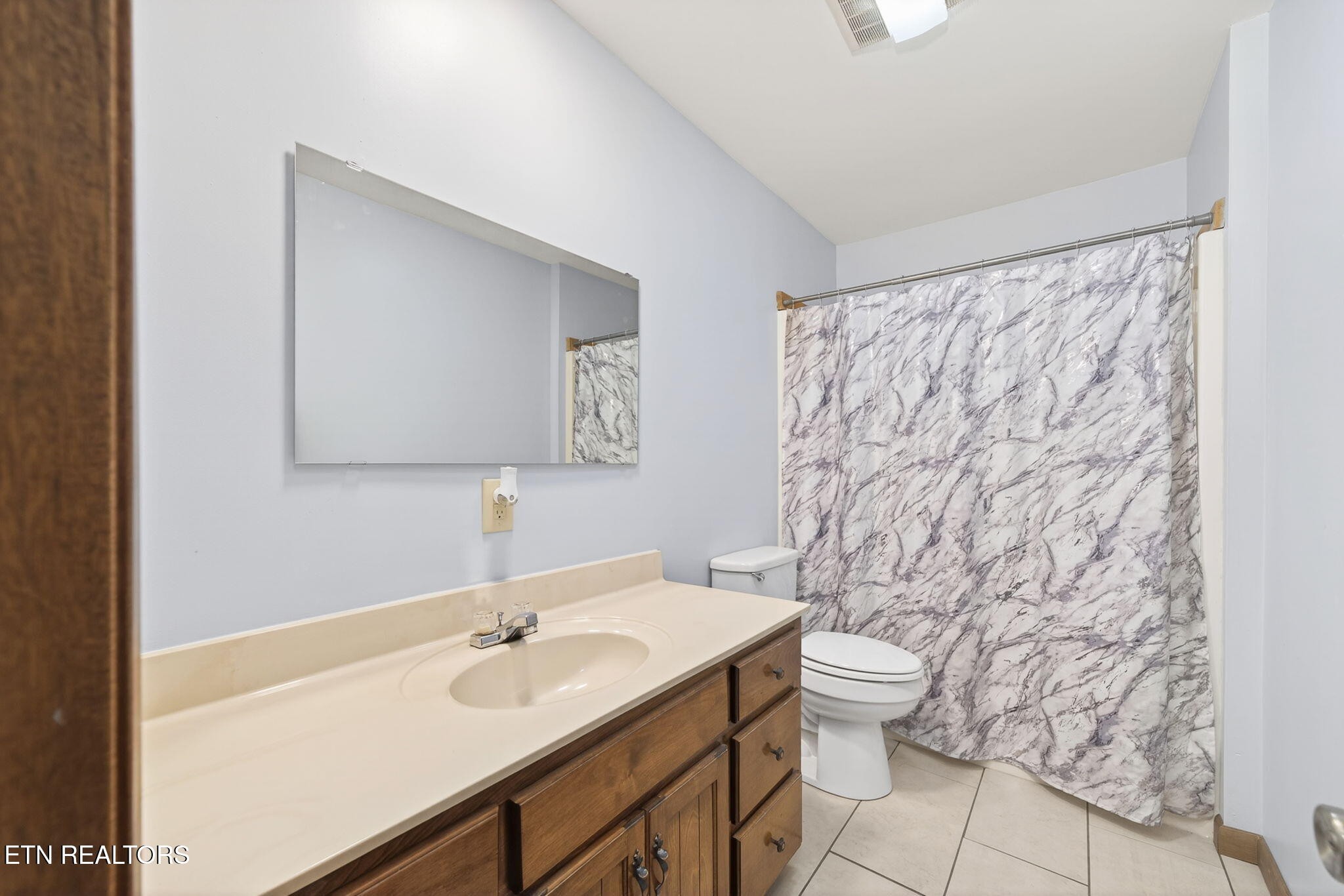 935 Brewer Road Crossville, TN 38572 - Photo 30 of 51 a bathroom with a sink and a mirror