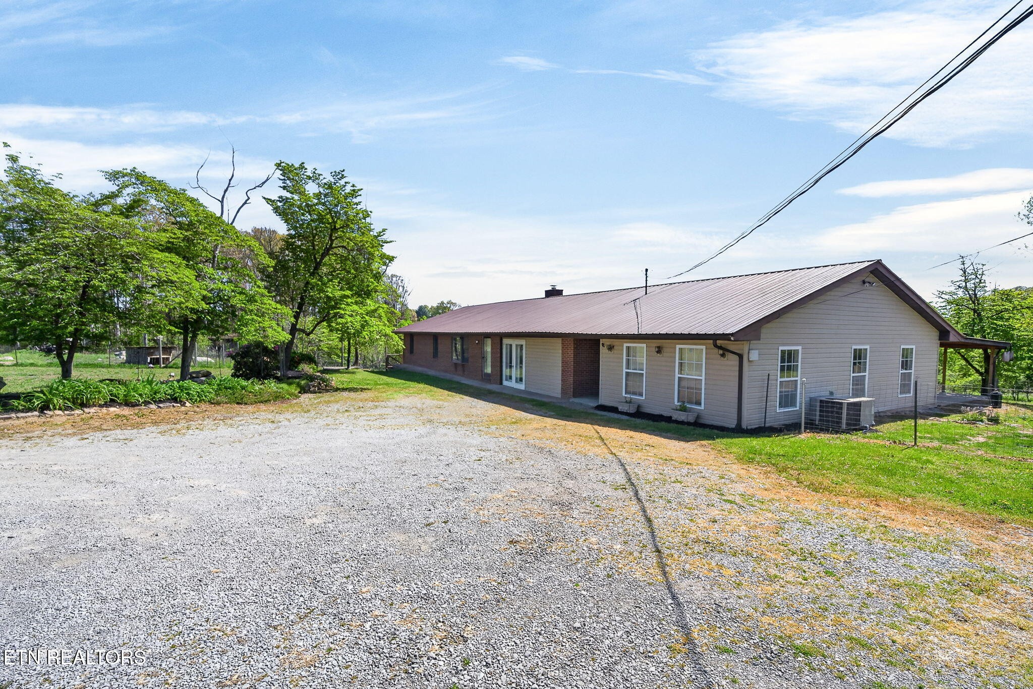 935 Brewer Road Crossville, TN 38572 - Photo 3 of 51 a front view of a house with a yard and garage