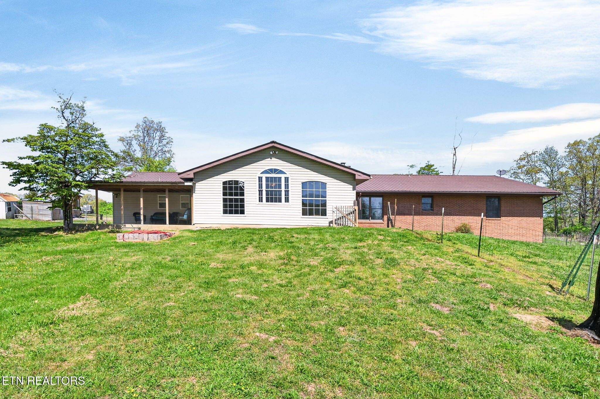 935 Brewer Road Crossville, TN 38572 - Photo 4 of 51 a front view of a house with a garden