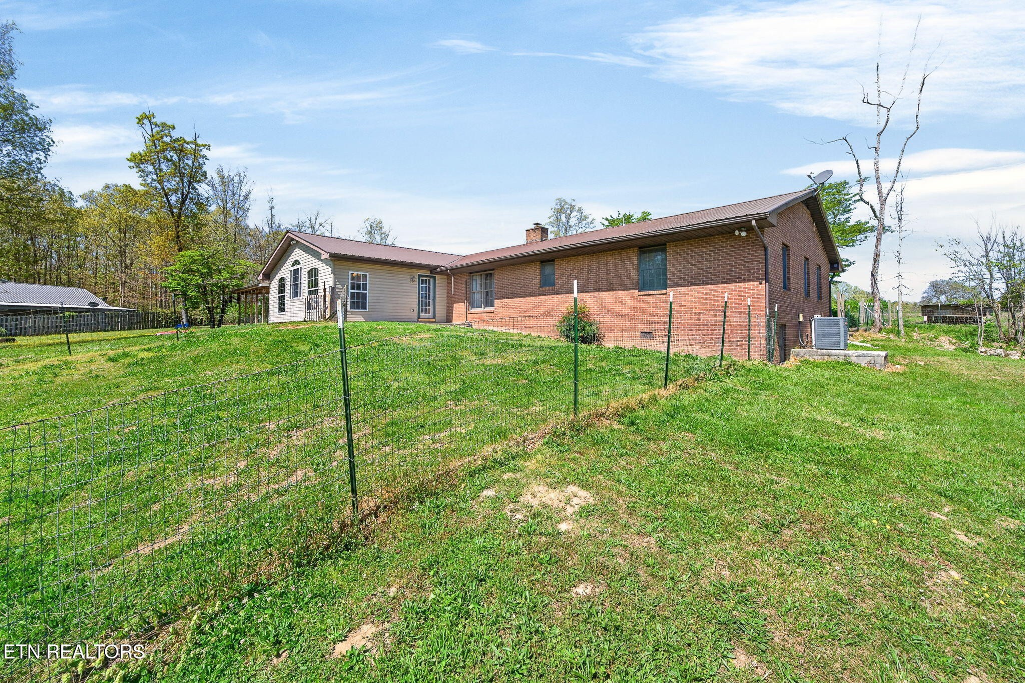 935 Brewer Road Crossville, TN 38572 - Photo 48 of 51 a view of a yard in front of a house with large trees