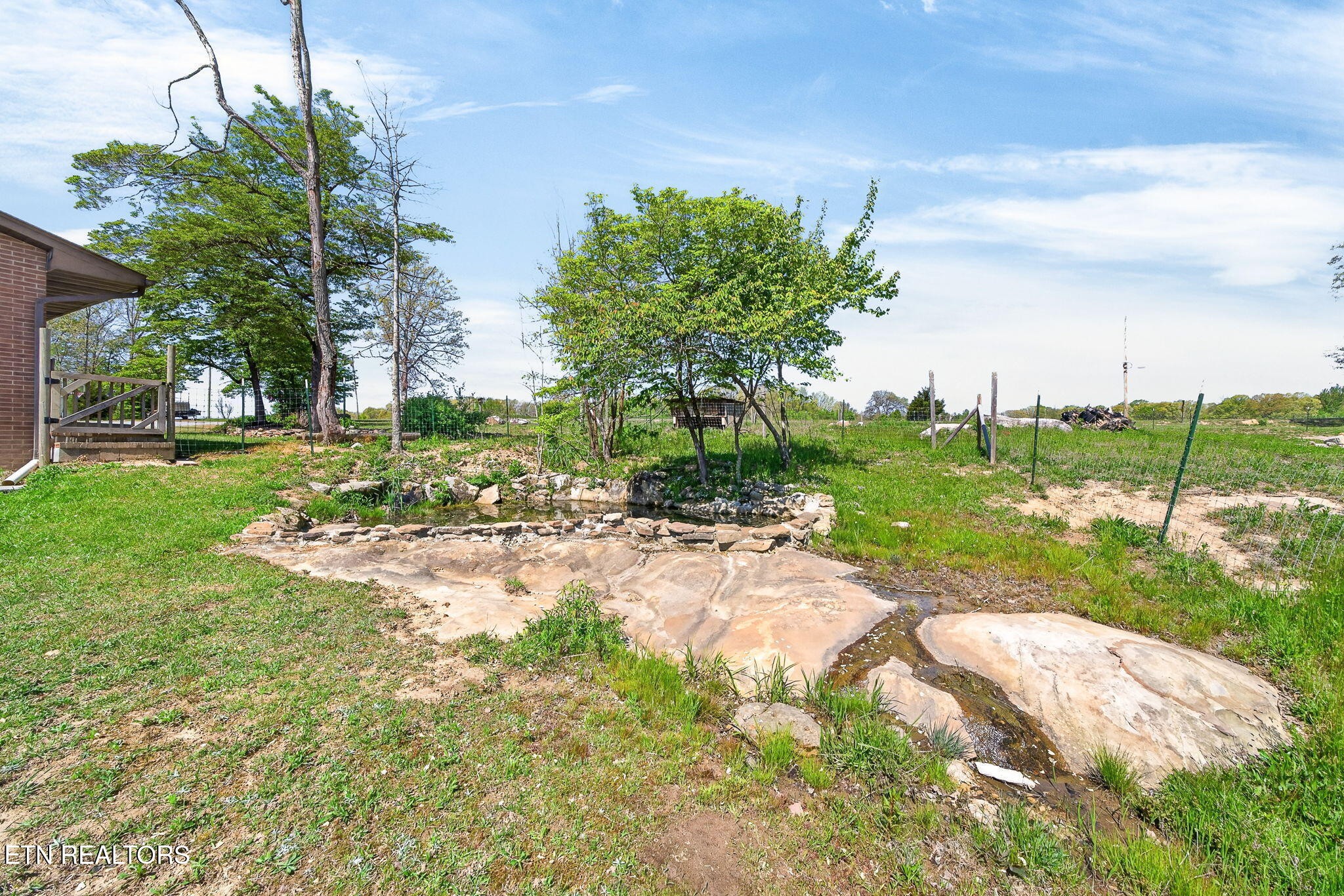 935 Brewer Road Crossville, TN 38572 - Photo 49 of 51 a view of a garden with a building in the background