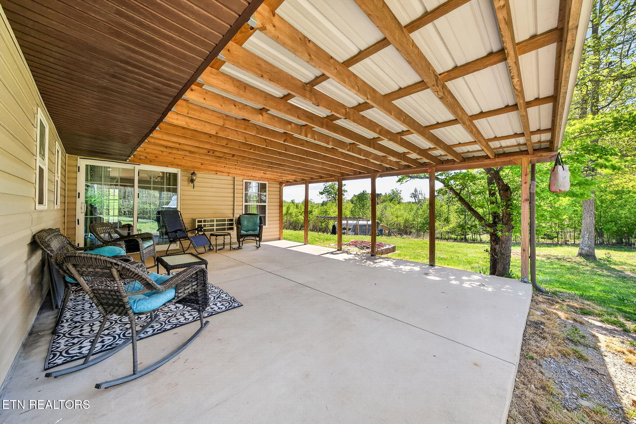935 Brewer Road Crossville, TN 38572 - Photo 7 of 51 a building outdoor space with patio furniture and garden
