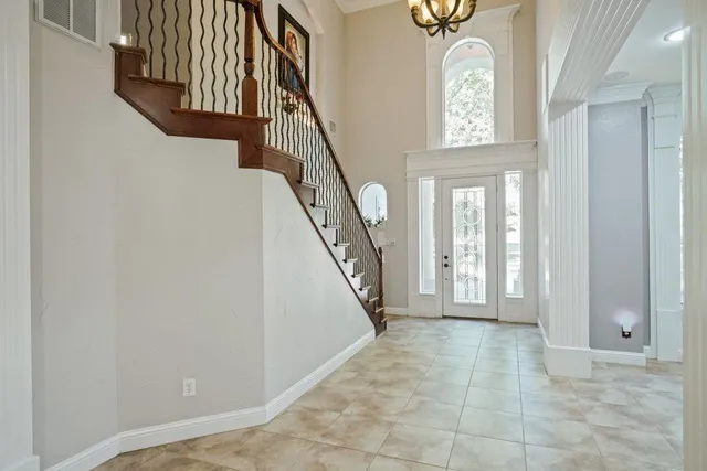 a view of entryway and hall with a front door
