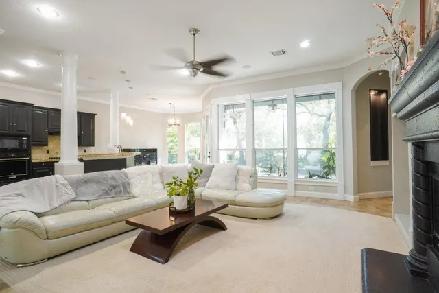 a living room with furniture and a fireplace