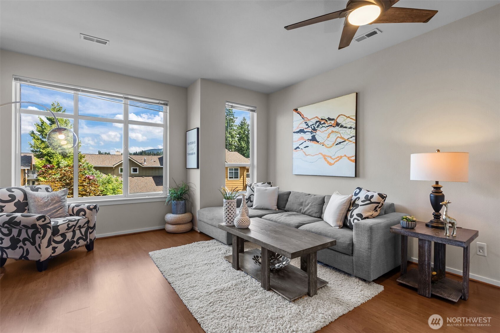 67 Cougar Ridge Road Northwest, Unit 2013 Issaquah, WA 98027 - Photo 1 of 33 a living room with furniture and a window