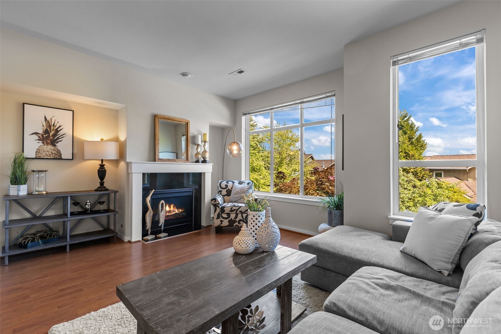 67 Cougar Ridge Road Northwest, Unit 2013 Issaquah, WA 98027 - Photo 2 of 33 a living room with furniture and a fireplace