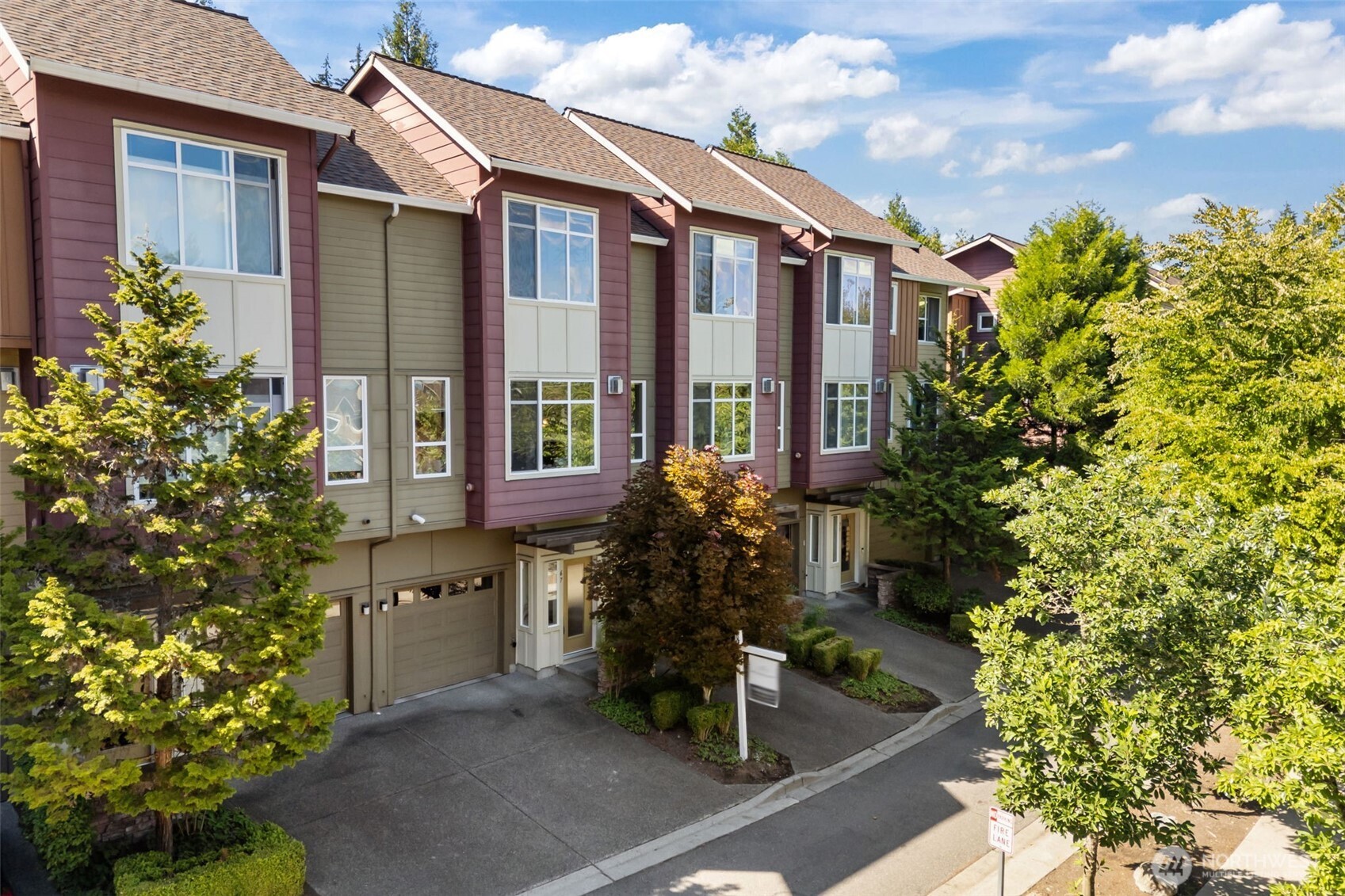 67 Cougar Ridge Road Northwest, Unit 2013 Issaquah, WA 98027 - Photo 26 of 33 front view of a house with a tree