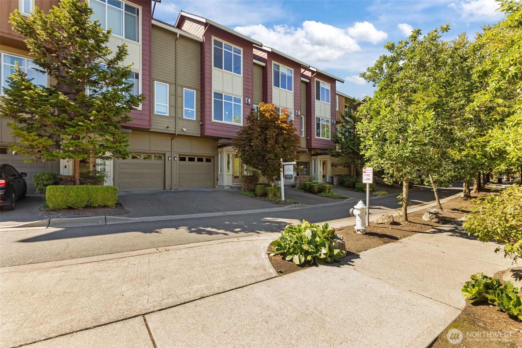 67 Cougar Ridge Road Northwest, Unit 2013 Issaquah, WA 98027 - Photo 27 of 33 a view of a building with a street
