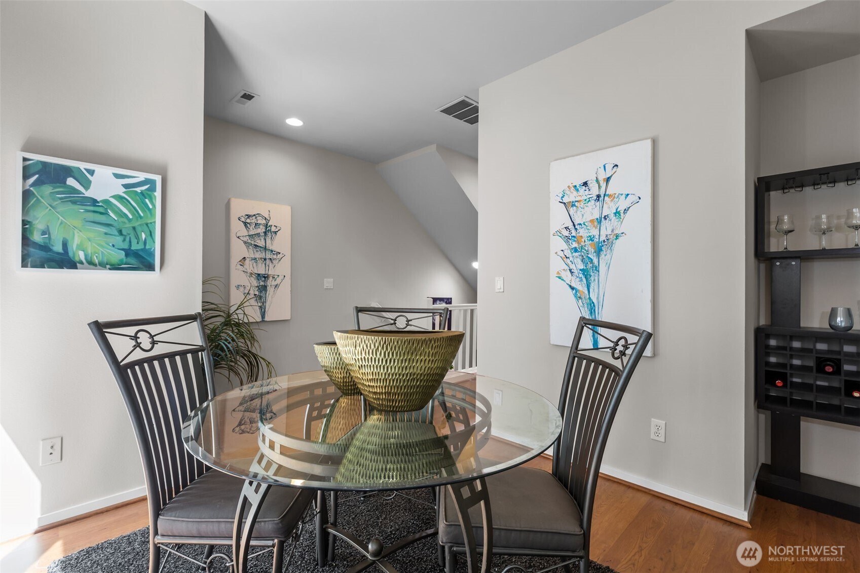 67 Cougar Ridge Road Northwest, Unit 2013 Issaquah, WA 98027 - Photo 6 of 33 a view of a dining room with furniture and wooden floor