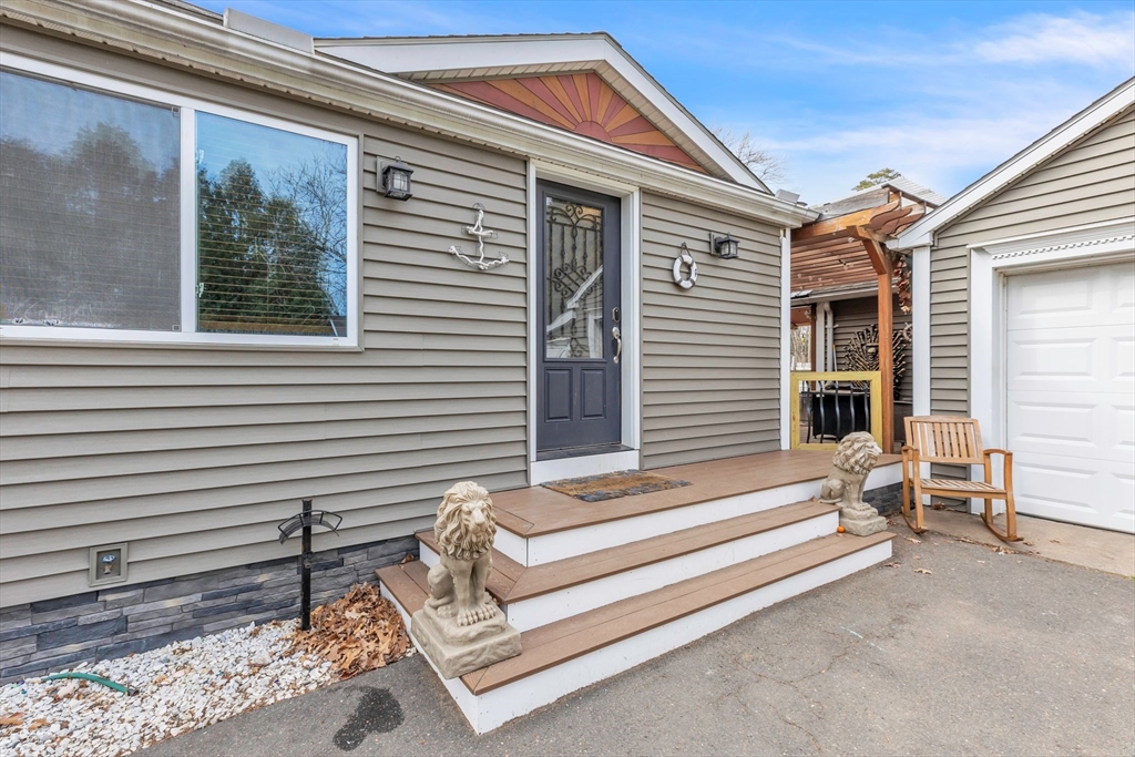 6 Babb Road Southwick, MA 01077 - Photo 12 of 42 a front view of a house with a porch