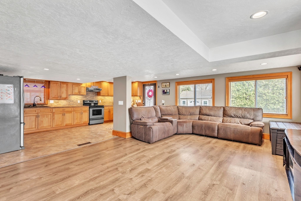 6 Babb Road Southwick, MA 01077 - Photo 16 of 42 a living room with furniture and view of kitchen