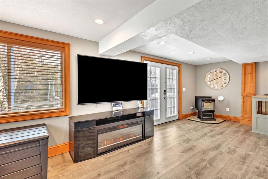 6 Babb Road Southwick, MA 01077 - Photo 17 of 42 a living room with furniture and a flat screen tv