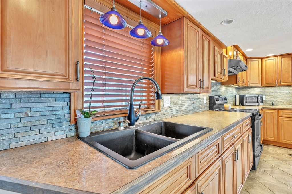6 Babb Road Southwick, MA 01077 - Photo 22 of 42 a kitchen that has a sink and a stove
