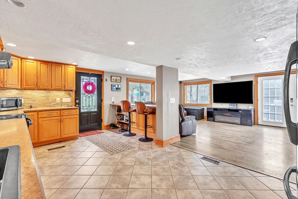 6 Babb Road Southwick, MA 01077 - Photo 23 of 42 a view of a living room kitchen and a window