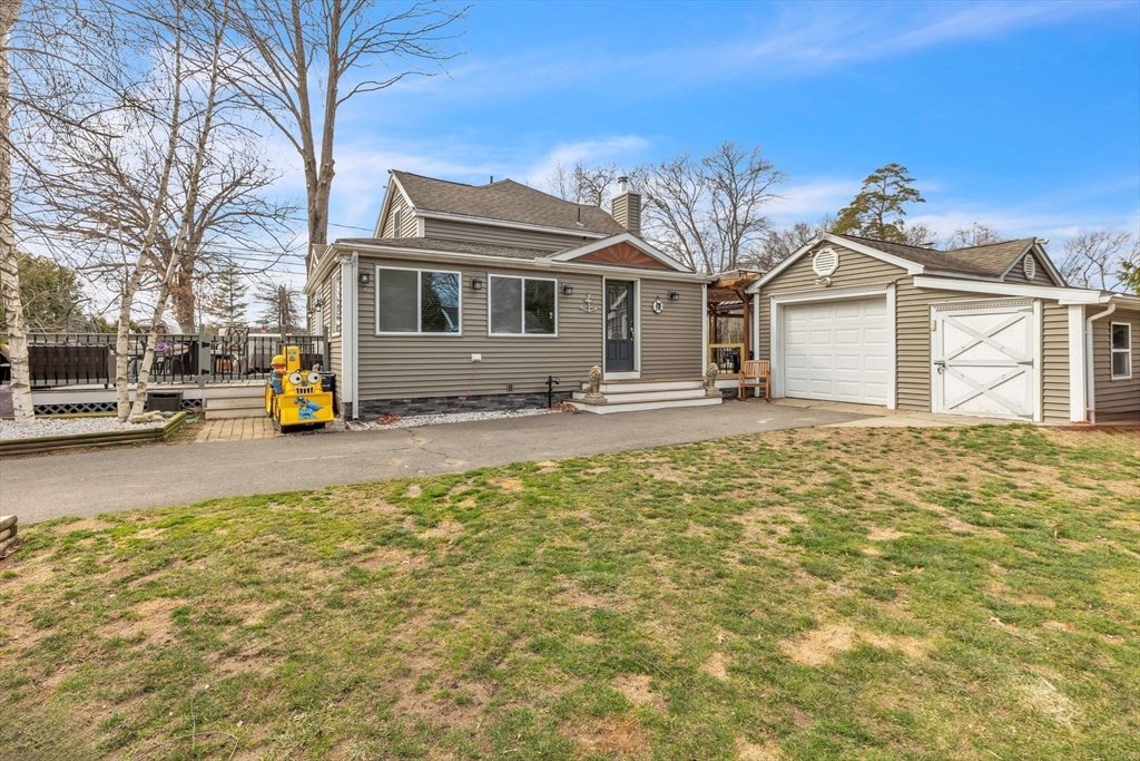 6 Babb Road Southwick, MA 01077 - Photo 3 of 42 a front view of a house with large garden