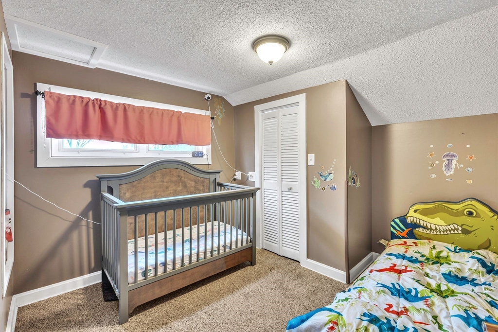 6 Babb Road Southwick, MA 01077 - Photo 37 of 42 a bedroom with a bed and a window