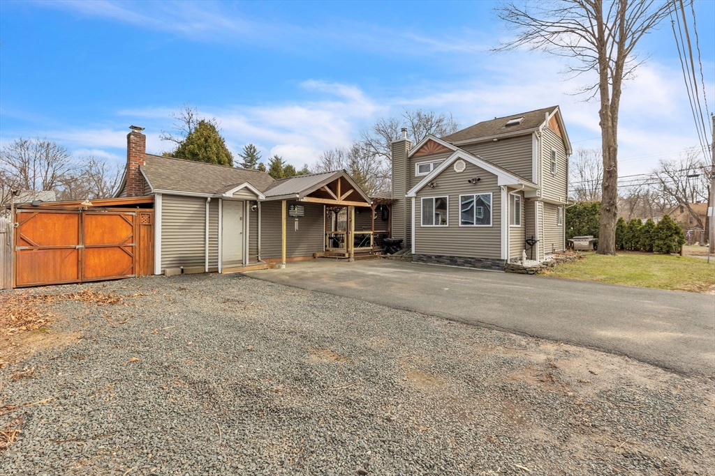 6 Babb Road Southwick, MA 01077 - Photo 10 of 42 a front view of a house with a yard and garage