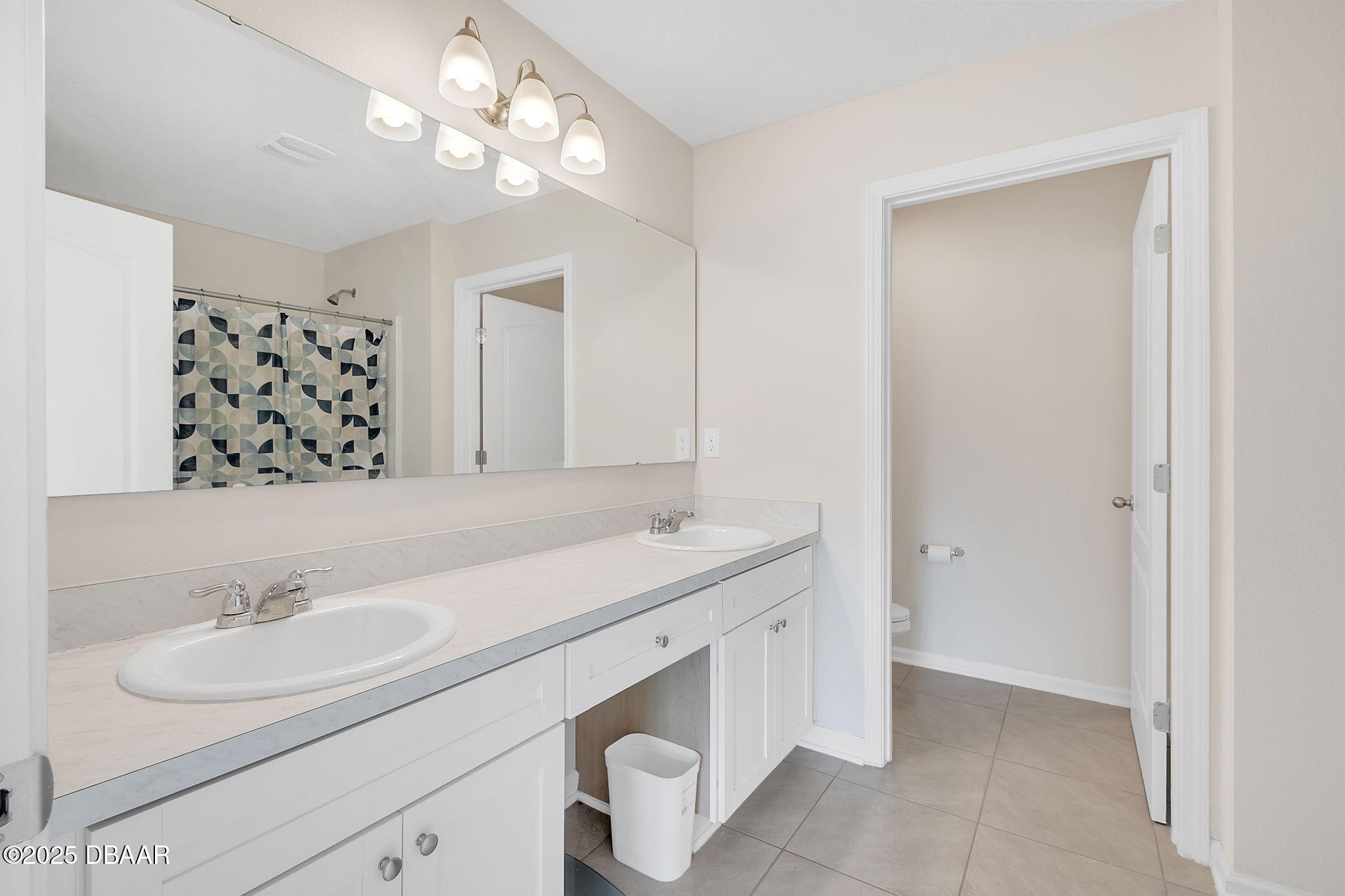 144 Redbud Road Palm Coast, FL 32137 - Photo 15 of 47 a bathroom with a sink double vanity and a mirror
