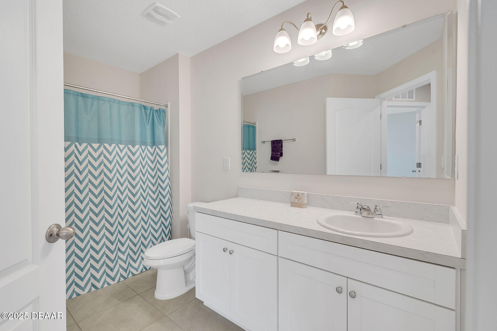 144 Redbud Road Palm Coast, FL 32137 - Photo 23 of 47 a bathroom with a sink toilet vanity and shower