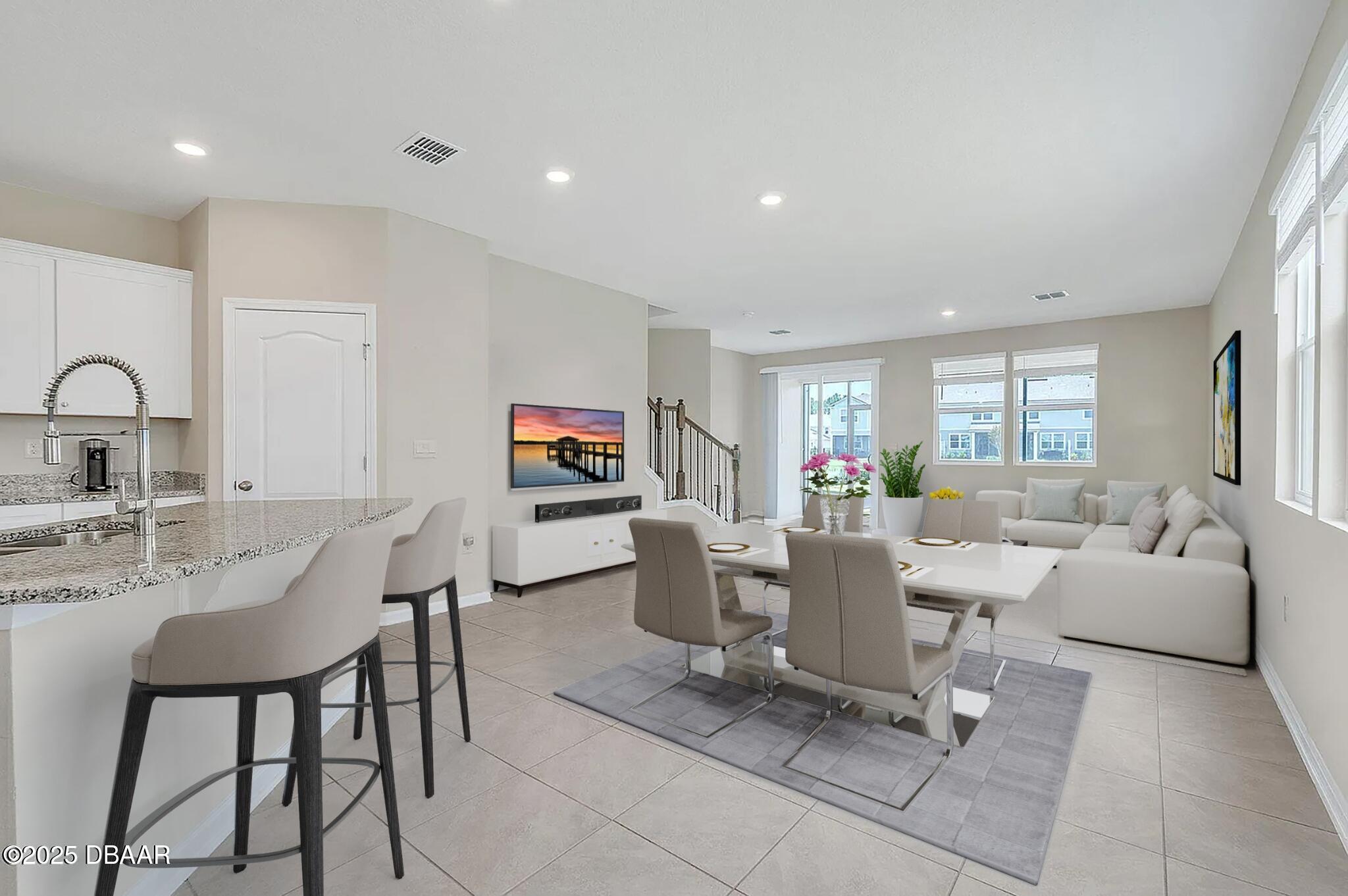 144 Redbud Road Palm Coast, FL 32137 - Photo 4 of 47 a living room with furniture and a large window