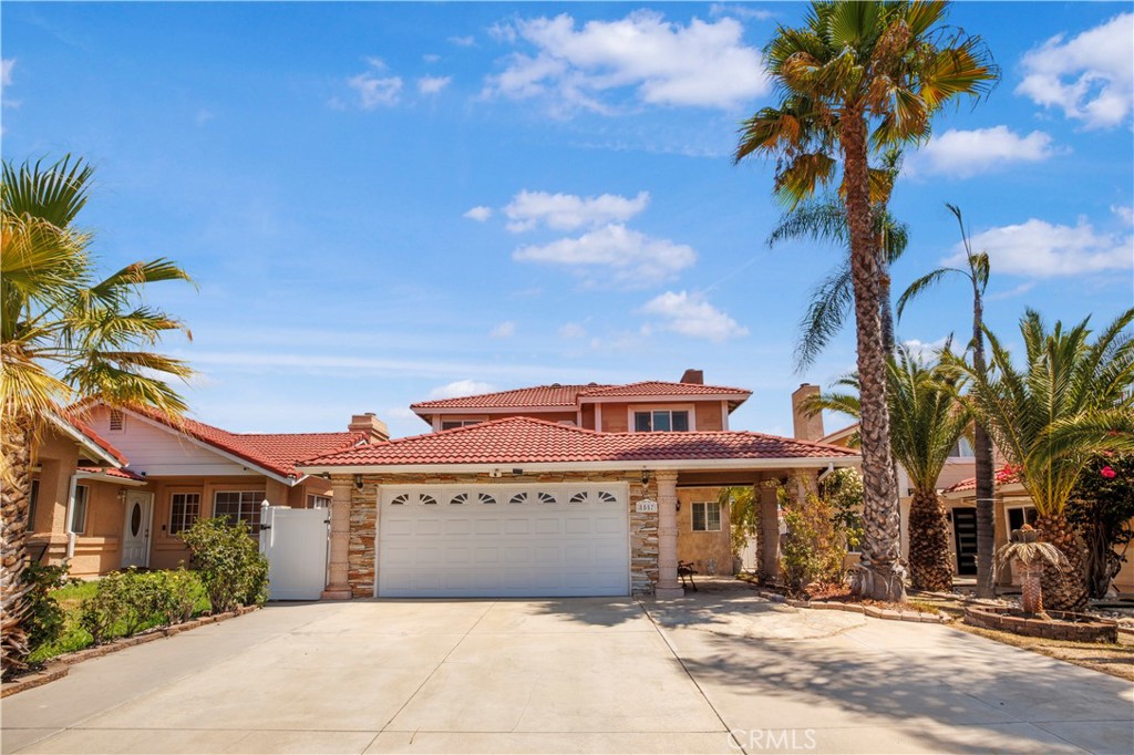 8557 Edwin Street Rancho Cucamonga, CA 91730 - Photo 1 of 1 a front view of a house with a garden