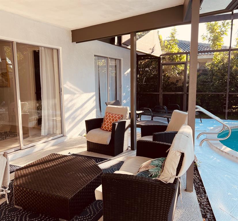 2908 Captiva Drive Sarasota, FL 34231 - Photo 11 of 12 a living room with furniture and a large window