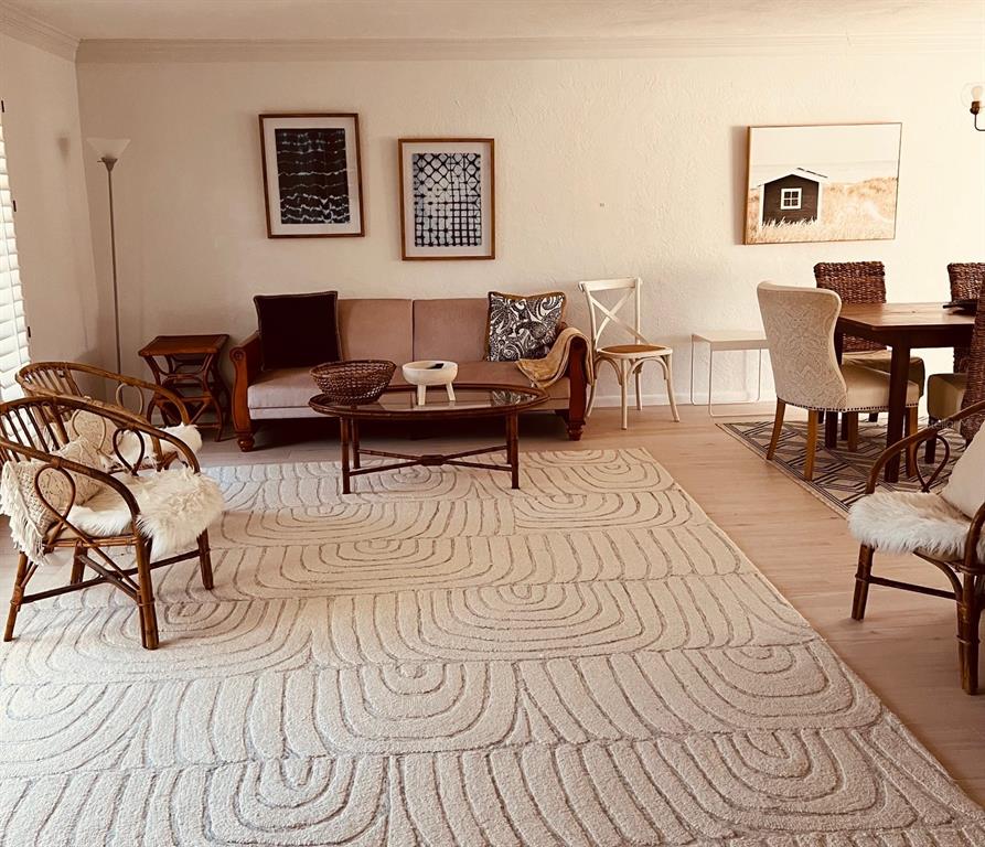 2908 Captiva Drive Sarasota, FL 34231 - Photo 3 of 12 a living room with furniture and a wooden floor