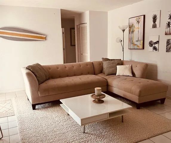 a living room with furniture and a rug
