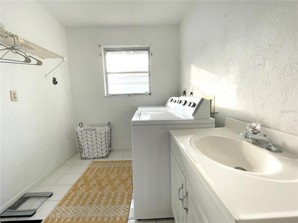 2908 Captiva Drive Sarasota, FL 34231 - Photo 7 of 12 a bathroom with a sink and a mirror