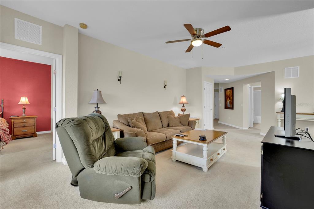 1278 Grady Lane Davenport, FL 33896 - Photo 3 of 17 a living room with furniture and a ceiling fan
