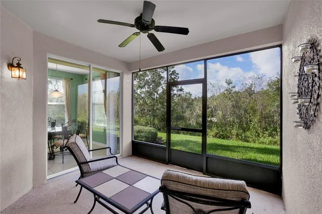 a living room with hardwood floor and balcony view
