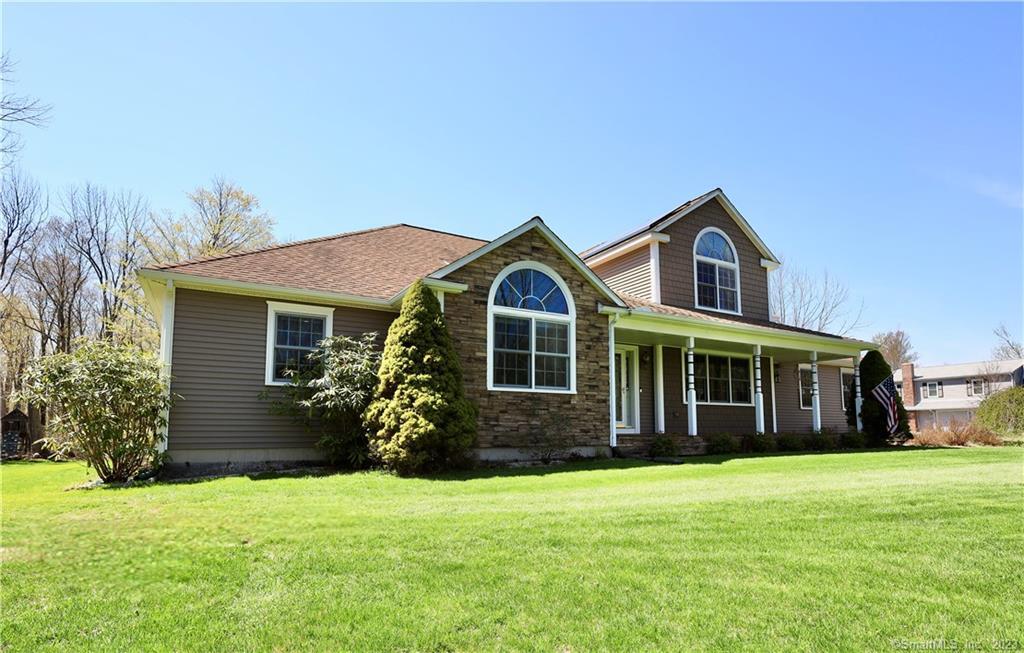 216 S Road Winchester, CT 06098 - Photo 1 of 1 a front view of a house with garden